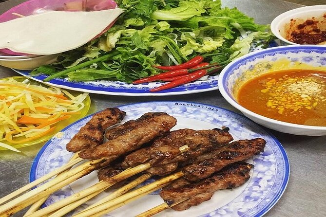 Da Nang Food Tour Motorbike & Sightseeing By Ao Dai Lady Rider - Love Bridge starts the evening by the Han River