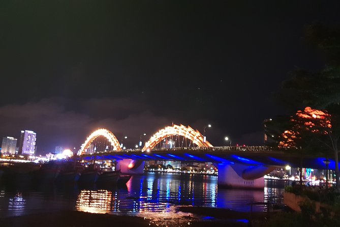 DA NANG NIGHTLIFE Tour with MARBLE MOUNTAIN & LADY BUDDHA STATUE, DRAGON BRIDGE - Dragon Bridge after dark, with a weekend fire show
