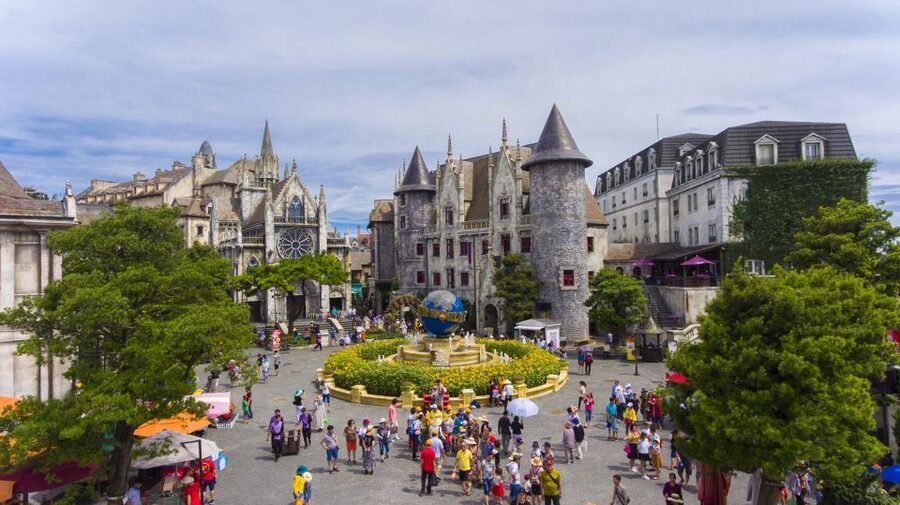 From Da Nang: Ba Na Hills Golden Bridge Day Tour & Lunch - Riding the cable car above Nui Chua