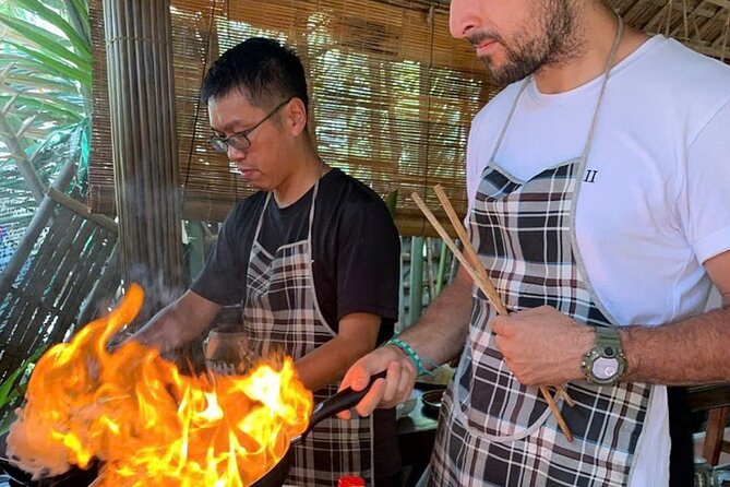 RICE PAPER Noodle Making Experience & Hoi An Cooking Class Class - Catching purple crabs with a local fisherman